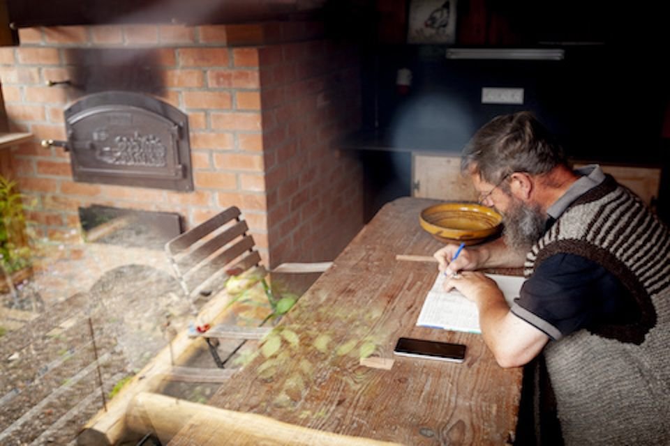 Farmer writing in farmhouse (2024)